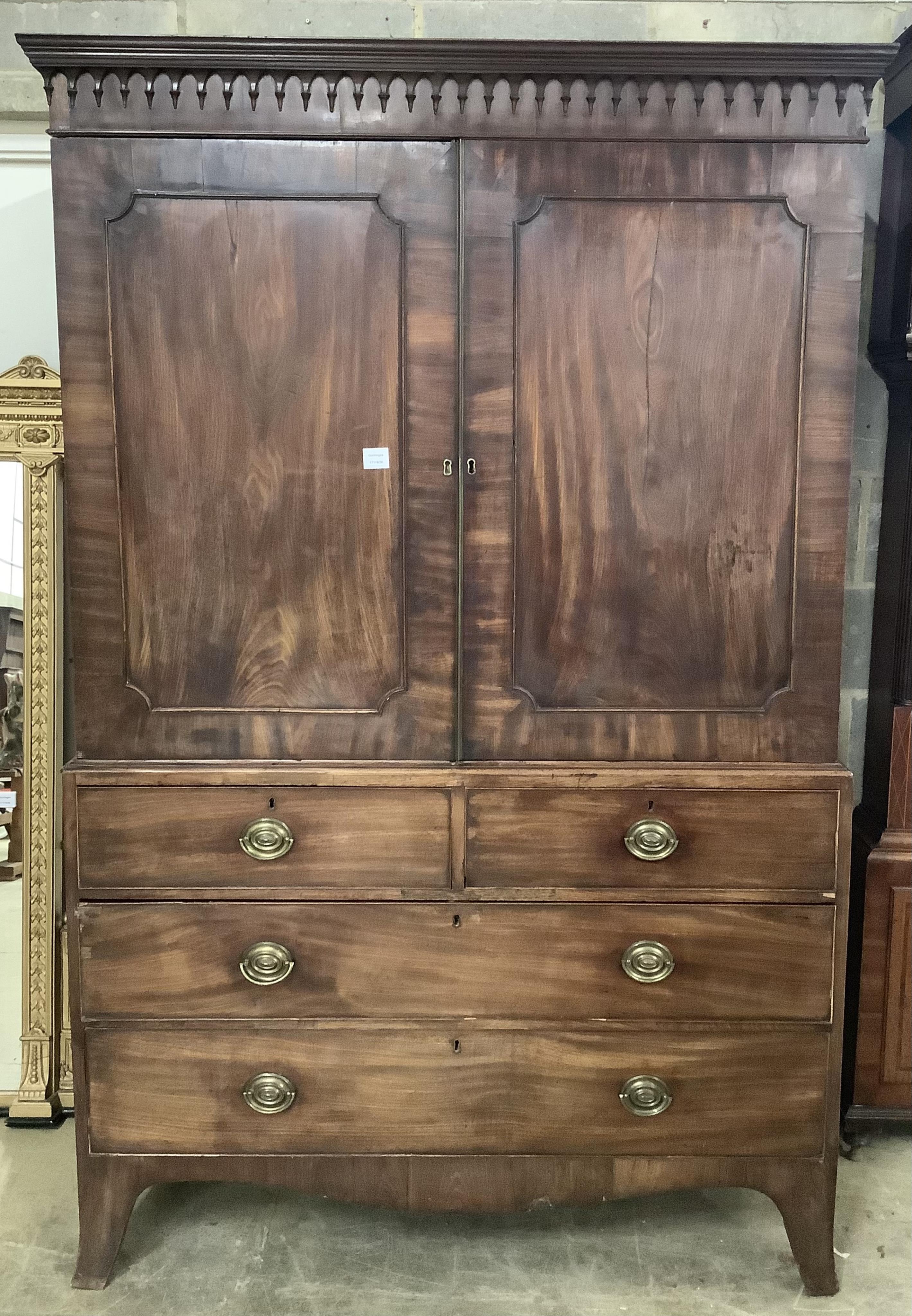 A George III mahogany linen press, width 130cm, depth 61cm, height 202cm. Condition - fair